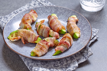 Roasted avocado pieces wrapped in bacon