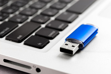 USB Flash drive on computer laptop keyboard