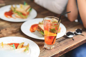 Happy friends having lunch in cafe