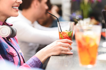 Group of young friends meeting in cafe