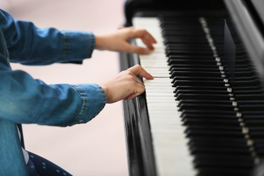 Small girl playing piano