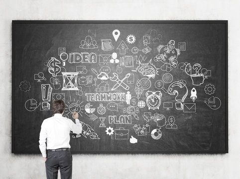 Businessman drawing business sketch