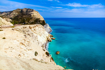Fototapeta na wymiar Cyprus coastline. Beautiful view of Mediterranean Sea and mountains landscape on the road to Paphos
