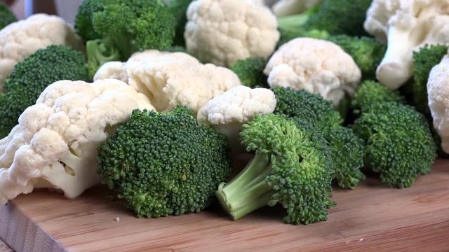 Zoom in shot on broccoli and cauliflower with cheese sauce

