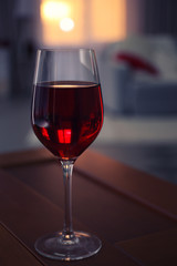 Glass of red wine on blurred background