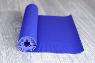 Mat for fitness on wooden floor