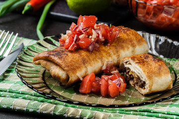 Mexican chimichanga with salsa dip