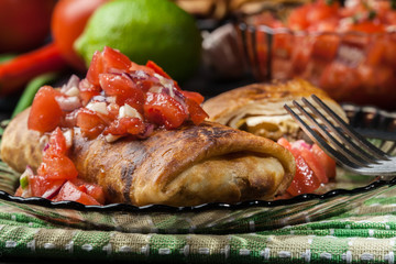 Mexican chimichanga with salsa dip