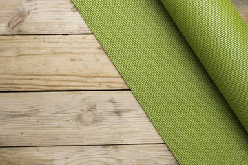 yoga mat on the wood table