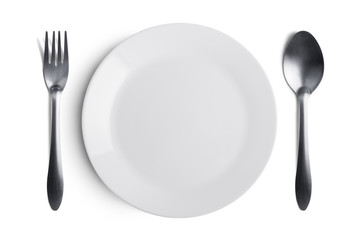 White plate with silver fork and spoon with clipping path