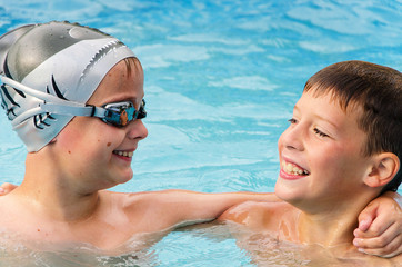 happy boys in the swimming pool