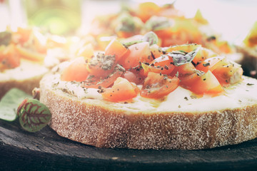 Sandwich with tomatoes, goat cheese and basil