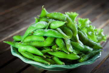 Japan soybeans in the green plate on wood table