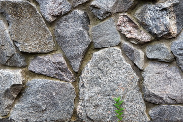 Natural untreated grunge stone wall background