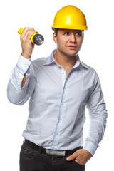 Male in yellow safety helmet and flashlight.