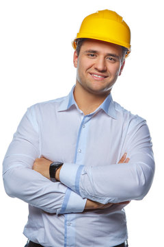 Portrait of positive worker male in yellow safe helmet.