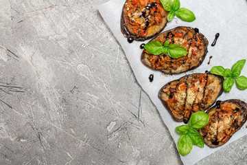 Baked eggplant stuffed with vegetables and cheese