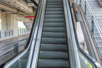 escalators stairway inside modern office building