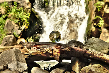 Mountain waterfall in crystal ball
