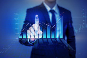 Close up of businessman touching finance graph in virtual screen