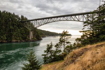 Fototapeta premium Deception Pass Bridge in Washgton, United States. Taken during a cloudy sunset.