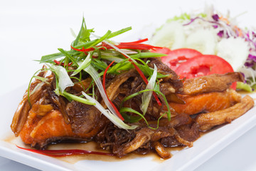 Fusion food of fried fish salmon with Thai food style