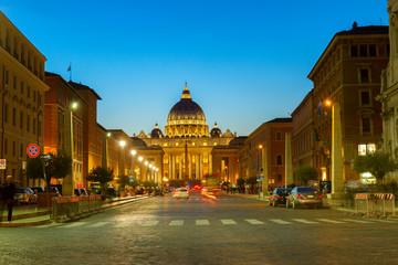 Fototapeta na wymiar road to St. Peter's cathedral in Rome at night with lights, Italy