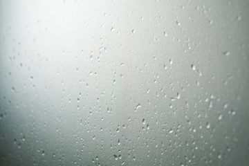 Frosted glass texture with droplets, selective focus, shallow depth of field