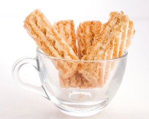 biscuit in empty milk glass cup