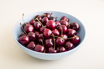 Red cherries in antique bowl