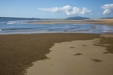 Beach at Lucinda, Far North Queensland, with sugar jetty in the background.
