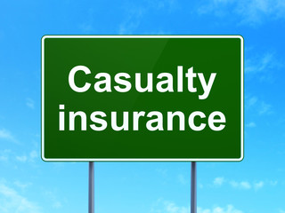 Insurance concept: Casualty Insurance on road sign background