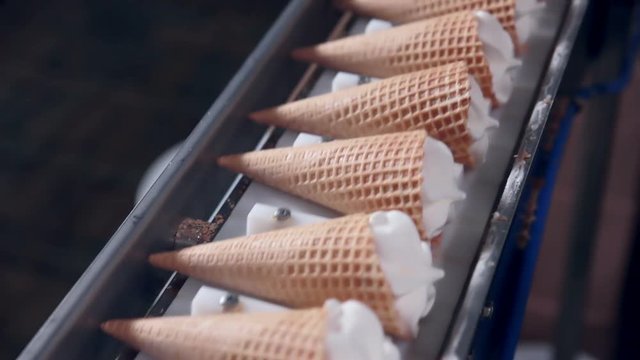 Modern ice cream automatic production line. Automatic equipment at the food factory. 1080p.