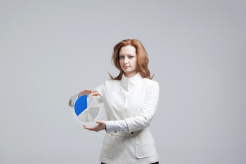 Woman shows a pie chart, circle diagram. Business analytics concept.