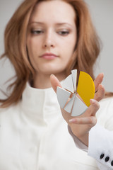 Woman shows a pie chart, circle diagram. Business analytics concept.