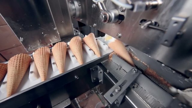 Modern ice cream automatic production line. Automatic equipment at the food factory. 1080p.