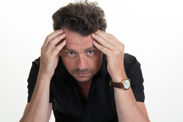 Naklejka premium Man having a headache isolated on white