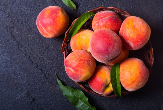 Ripe Peaches In Basket