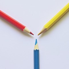 Triangle primary color pencils / Three primary color by pencil in triangle shape put on the white paper