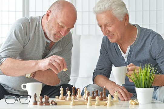 senior men  playing chess