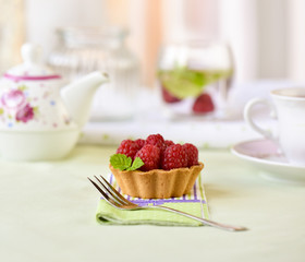 Fruit raspberry tarts on a table