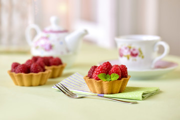 Fruit raspberry tarts on a table