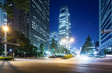Fototapeta na wymiar busy traffic on road in downtown of tokyo at night
