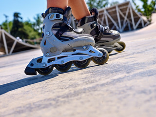 Roller skate close up in skatepark. Low section of children.