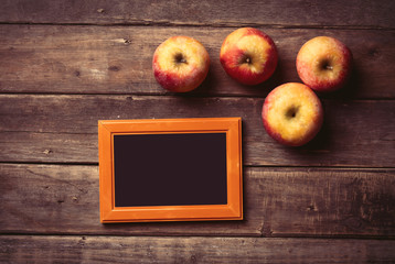 photo frame and apples