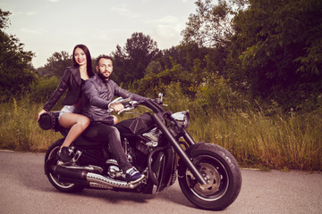 Fototapeta na wymiar Romantic picture with a couple of beautiful young bikers