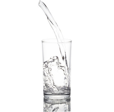 Water poured in a glass transparent white background