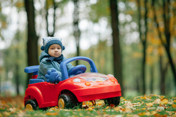 little funny boy driving toy car