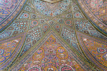 Persian patterns on tiled wall of mosque Nasir ol Molk with traditional artworks, Iran