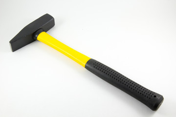 Hammer with the plastic handle on a white background